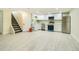 Modern basement kitchen with white cabinets and stainless steel appliances at 8501 E 104Th Ave, Henderson, CO 80640