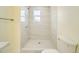 Clean bathroom featuring a walk-in shower and toilet at 8501 E 104Th Ave, Henderson, CO 80640