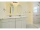 Bright bathroom with double vanity and walk-in shower at 8501 E 104Th Ave, Henderson, CO 80640