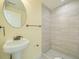 Simple bathroom with pedestal sink and shower at 8501 E 104Th Ave, Henderson, CO 80640