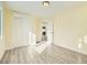 Sunlit bedroom with hardwood floors and closet at 8501 E 104Th Ave, Henderson, CO 80640