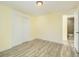 Well-lit bedroom with hardwood floors and closet at 8501 E 104Th Ave, Henderson, CO 80640