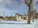 Tan house with snow covered yard, large tree at 8501 E 104Th Ave, Henderson, CO 80640