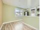 Kitchen with light green walls and white cabinets at 8501 E 104Th Ave, Henderson, CO 80640