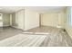 Bright living room with light gray vinyl flooring at 8501 E 104Th Ave, Henderson, CO 80640