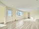 Living room with vinyl flooring and large window at 8501 E 104Th Ave, Henderson, CO 80640