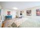 Spacious bedroom showcases unique artwork, hardwood floors, and a comfortable bed at 1155 N Ash St # 806, Denver, CO 80220