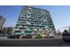 Modern building with unique architecture, blue and yellow accents, and well-maintained surroundings at 1155 N Ash St # 806, Denver, CO 80220