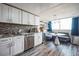 Modern kitchen featuring a dining area with stylish seating and ample natural light at 1155 N Ash St # 806, Denver, CO 80220