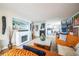 Cozy living room with fireplace, stylish decor, and open view to the kitchen at 1155 N Ash St # 806, Denver, CO 80220