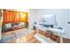 Well-lit office featuring a work desk and seating area with stylish decor and hardwood flooring at 1155 N Ash St # 806, Denver, CO 80220