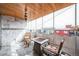 Inviting patio area featuring wood ceiling, fireplace, marble walls, seating, and an open view at 1155 N Ash St # 806, Denver, CO 80220