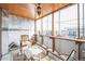 Inviting patio featuring wood ceiling, marble walls, tiled floors, and comfortable seating with a view at 1155 N Ash St # 806, Denver, CO 80220