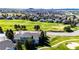 Beautiful aerial image showcases homes in a golf course community, with lush greens and scenic views at 3383 Mount Royal Dr # 46, Castle Rock, CO 80104