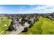 Picturesque aerial view of a residential neighborhood nestled along a golf course, offering stunning vistas at 3383 Mount Royal Dr # 46, Castle Rock, CO 80104
