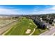 Beautiful aerial view of a residential area next to a golf course under a blue sky at 3383 Mount Royal Dr # 46, Castle Rock, CO 80104