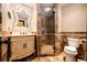 Elegant powder room with ornate mirror and stone shower at 3383 Mount Royal Dr # 46, Castle Rock, CO 80104