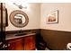 Elegant bathroom with dark wood vanity and granite countertop at 3383 Mount Royal Dr # 46, Castle Rock, CO 80104