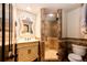 Elegant powder room with ornate mirror and stone shower at 3383 Mount Royal Dr # 46, Castle Rock, CO 80104