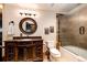 Basement bathroom with granite vanity and shower/tub combo at 3383 Mount Royal Dr # 46, Castle Rock, CO 80104