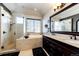 A luxury bathroom features a soaking tub, double vanity, and glass shower at 3383 Mount Royal Dr # 46, Castle Rock, CO 80104