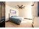 Comfortable guest bedroom with ceiling fan and large TV at 3383 Mount Royal Dr # 46, Castle Rock, CO 80104