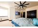 Second bedroom with ensuite bathroom access and TV at 3383 Mount Royal Dr # 46, Castle Rock, CO 80104