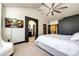 Bright bedroom with ensuite bathroom access and TV at 3383 Mount Royal Dr # 46, Castle Rock, CO 80104