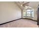 A bright bedroom with a ceiling fan and a large window at 3383 Mount Royal Dr # 46, Castle Rock, CO 80104