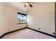 A bedroom with carpet flooring, black trim, and a window at 3383 Mount Royal Dr # 46, Castle Rock, CO 80104