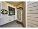 Charming home entryway featuring a decorative wreath, window and light fixture at 3383 Mount Royal Dr # 46, Castle Rock, CO 80104