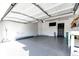 Spacious garage featuring a sealed floor, finished ceiling, ample lighting, and convenient access to the home at 3383 Mount Royal Dr # 46, Castle Rock, CO 80104