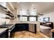 Open kitchen with island, stainless steel appliances, and breakfast bar at 3383 Mount Royal Dr # 46, Castle Rock, CO 80104