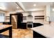 Well-appointed kitchen boasting quartz countertops, stainless steel appliances, and custom wood shelving at 3383 Mount Royal Dr # 46, Castle Rock, CO 80104