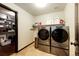 Convenient laundry room with washer, dryer, and shelving at 3383 Mount Royal Dr # 46, Castle Rock, CO 80104