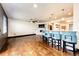 Spacious living room featuring hardwood floors, a fireplace, bar seating and plenty of room to entertain at 3383 Mount Royal Dr # 46, Castle Rock, CO 80104