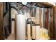 Basement utility room featuring a modern water heater and water softener at 3383 Mount Royal Dr # 46, Castle Rock, CO 80104