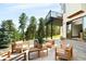 Outdoor patio with comfortable seating area and scenic views of nature at 29822 Troutdale Scenic Dr, Evergreen, CO 80439
