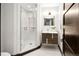 Modern bathroom featuring a glass shower, vanity, and stylish fixtures at 29822 Troutdale Scenic Dr, Evergreen, CO 80439