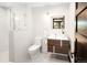 Modern bathroom featuring a glass-enclosed shower, floating vanity, and textured white tile at 29822 Troutdale Scenic Dr, Evergreen, CO 80439