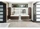 Bright modern bathroom featuring dual sinks, sleek vanities, and a large window offering natural light at 29822 Troutdale Scenic Dr, Evergreen, CO 80439