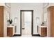 Modern bathroom with double vanities and decorative mirrors at 29822 Troutdale Scenic Dr, Evergreen, CO 80439