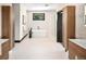 A bright bathroom featuring double vanities, a soaking tub, and a separate glass shower at 29822 Troutdale Scenic Dr, Evergreen, CO 80439