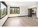 A spacious bedroom with scenic views, a large window, and light wood flooring at 29822 Troutdale Scenic Dr, Evergreen, CO 80439