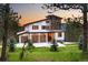 Stunning modern home boasts a sleek design, a three-car garage, and picturesque landscaping at 29822 Troutdale Scenic Dr, Evergreen, CO 80439