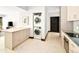 Kitchen boasts a center island, stainless appliances, and a convenient laundry setup at 29822 Troutdale Scenic Dr, Evergreen, CO 80439
