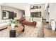 Bright living room featuring an open floor plan, modern decor, and large windows at 29822 Troutdale Scenic Dr, Evergreen, CO 80439