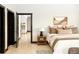 Spacious main bedroom with en suite bathroom, stylish décor, and ample natural light at 29822 Troutdale Scenic Dr, Evergreen, CO 80439