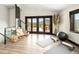 A bright yoga room with mountain views, exercise equipment, and natural light at 29822 Troutdale Scenic Dr, Evergreen, CO 80439