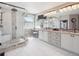 Spacious bathroom features dual vanity sinks, granite counters, and a tiled shower with seat at 9531 Desert Willow Way, Highlands Ranch, CO 80129